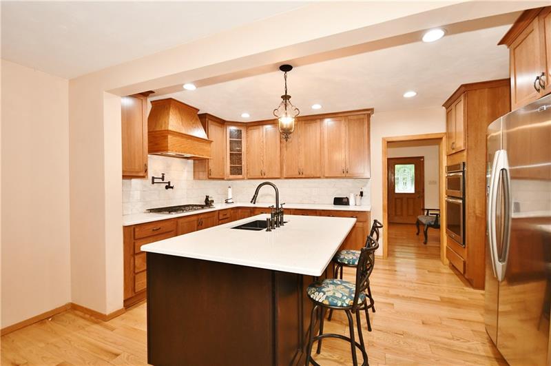 1154 Sugar Run Road Venetia, PA 15367 - Photo 11 of 24 Updated kitchen with large island, stainless steel appliances and quartz counter tops.