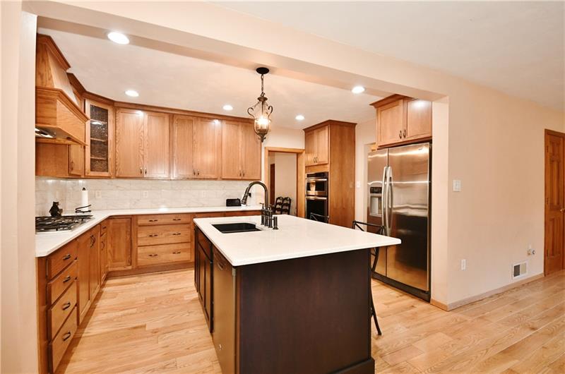 1154 Sugar Run Road Venetia, PA 15367 - Photo 12 of 24 Kitchen with island with seating, gas cook top and double stove and oversized refrigerator.