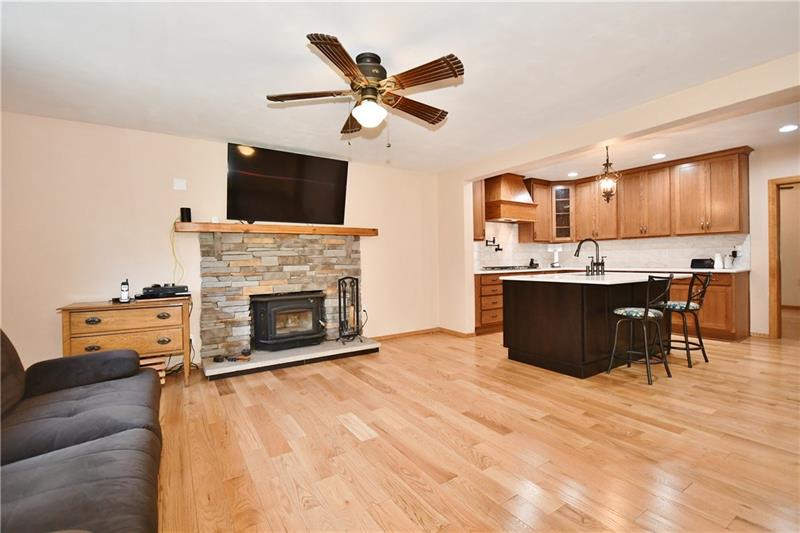 1154 Sugar Run Road Venetia, PA 15367 - Photo 14 of 24 Livingroom has beautiful wood burner that heats entire downstairs.