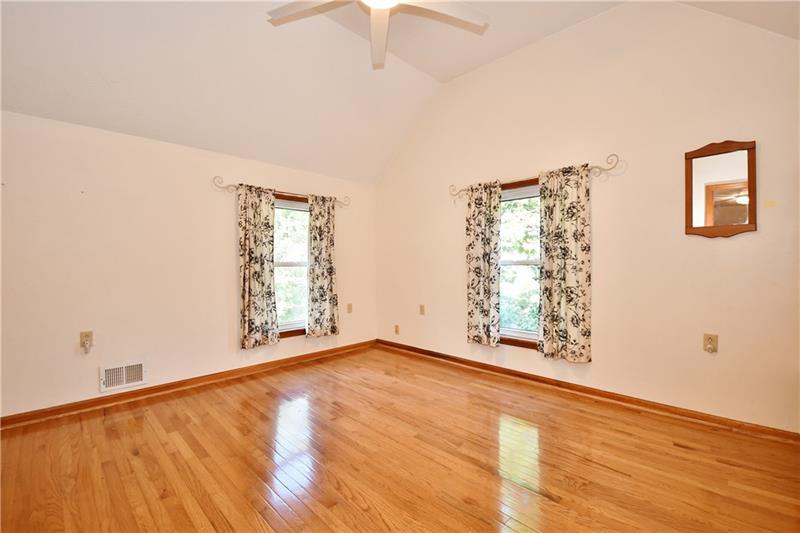 1154 Sugar Run Road Venetia, PA 15367 - Photo 21 of 24 Beautiful wood floors in many rooms. This is a large bedroom with vaulted ceiling.