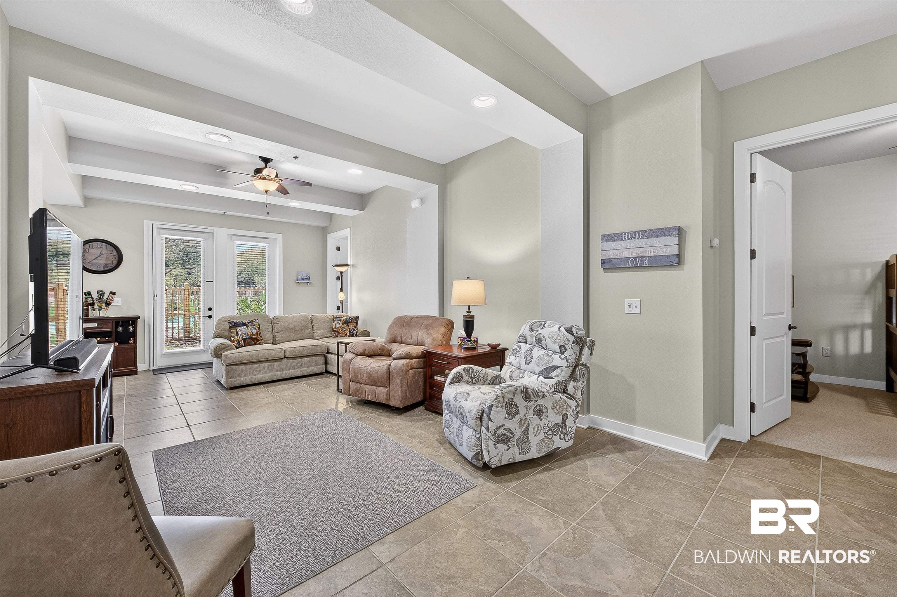 1430 West Regency Road, Unit I102 Gulf Shores, AL 36542 - Photo 5 of 31 Living area with a ceiling fan, recessed lighting, and light tile patterned floors
