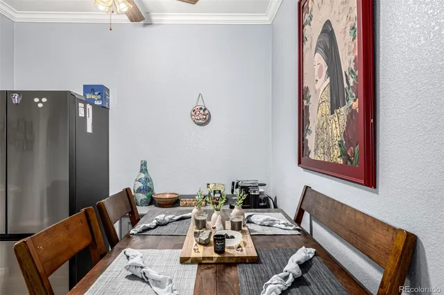a dinning room with furniture and wooden floor