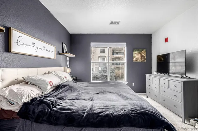 a bedroom with a bed and furniture