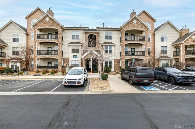 a view of multiple houses with a street
