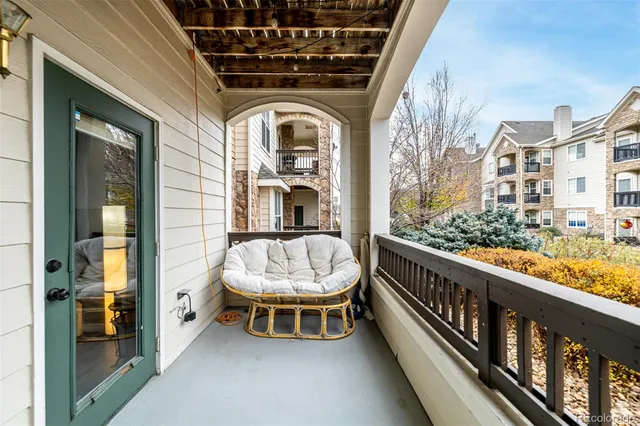 a view of balcony with furniture