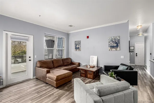 a living room with furniture and a table