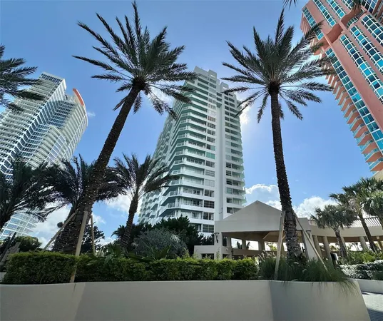 a view of a palm trees in front of a building