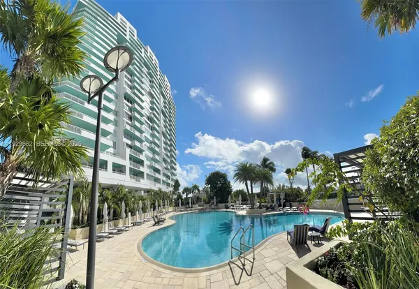 a view of a swimming pool with a patio
