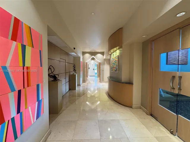 a view of a living room and a large window