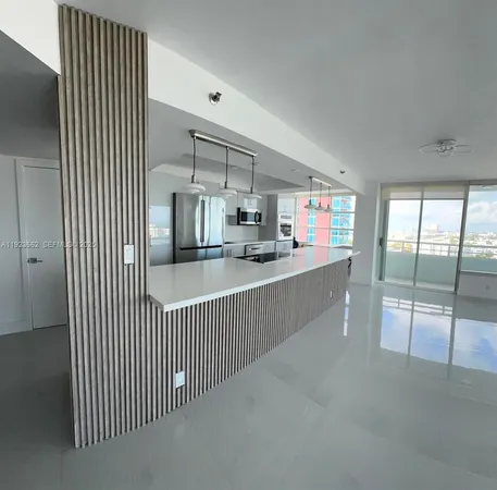 a view of a kitchen with kitchen and windows
