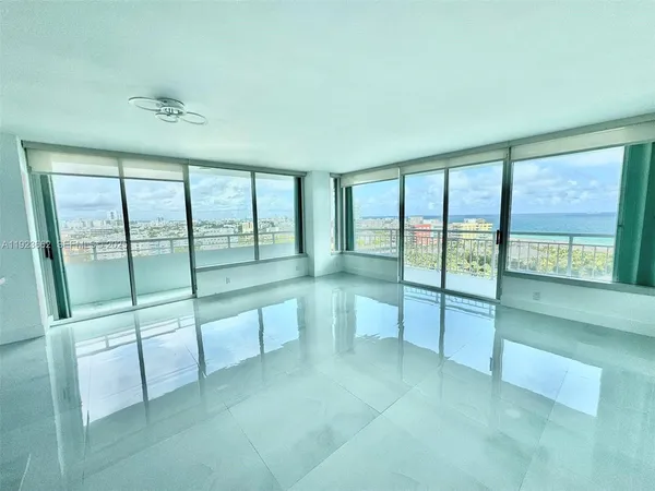 a view of an empty room with glass door
