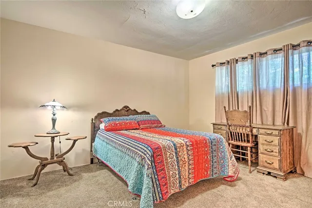 a bedroom with a bed and cabinets