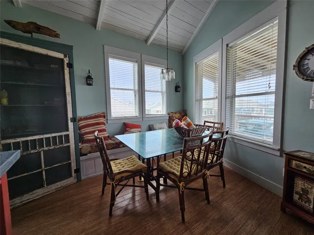 a view of a dining room with furniture and window