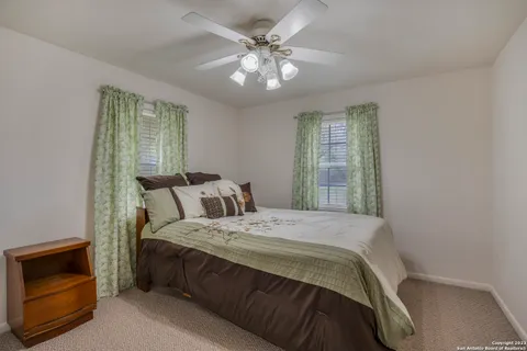 a bedroom with a bed and a fireplace