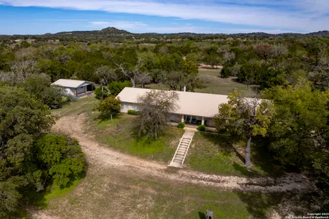 an aerial view of a house with a garden
