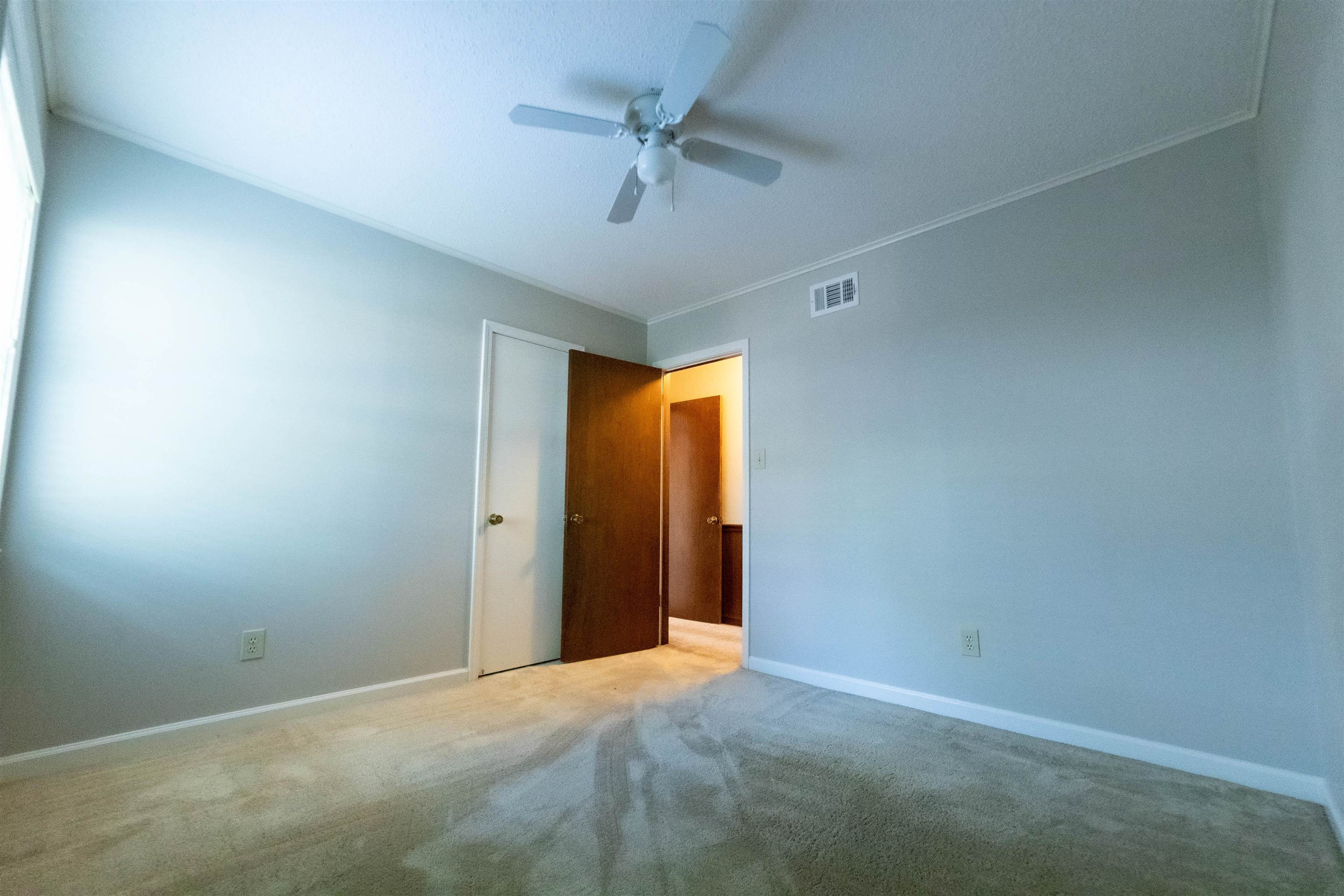 653 Oak Wild Cove Collierville, TN 38017 - Photo 17 of 20 Carpeted empty room with ceiling fan and crown molding