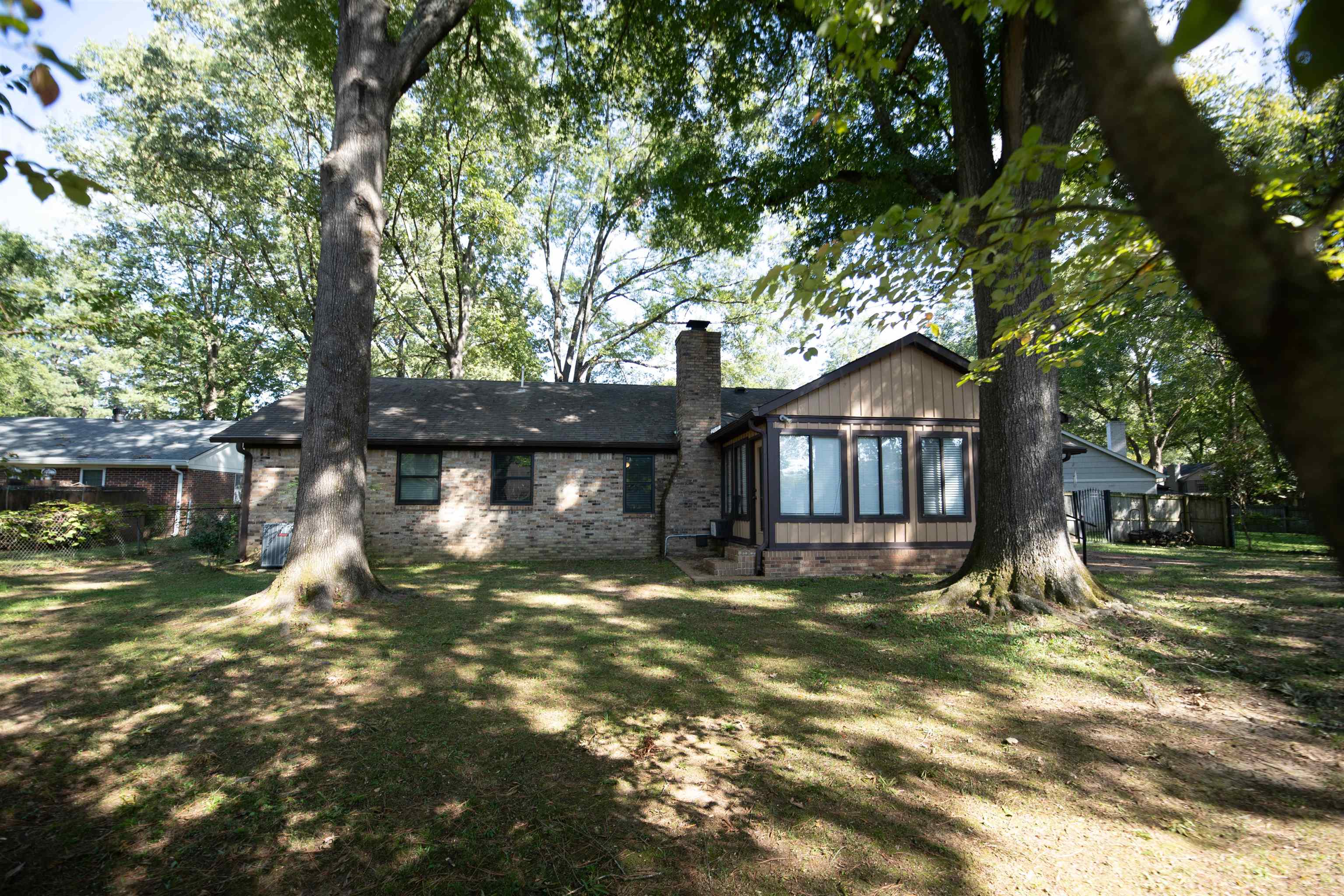 653 Oak Wild Cove Collierville, TN 38017 - Photo 2 of 20 Back of house featuring a lawn