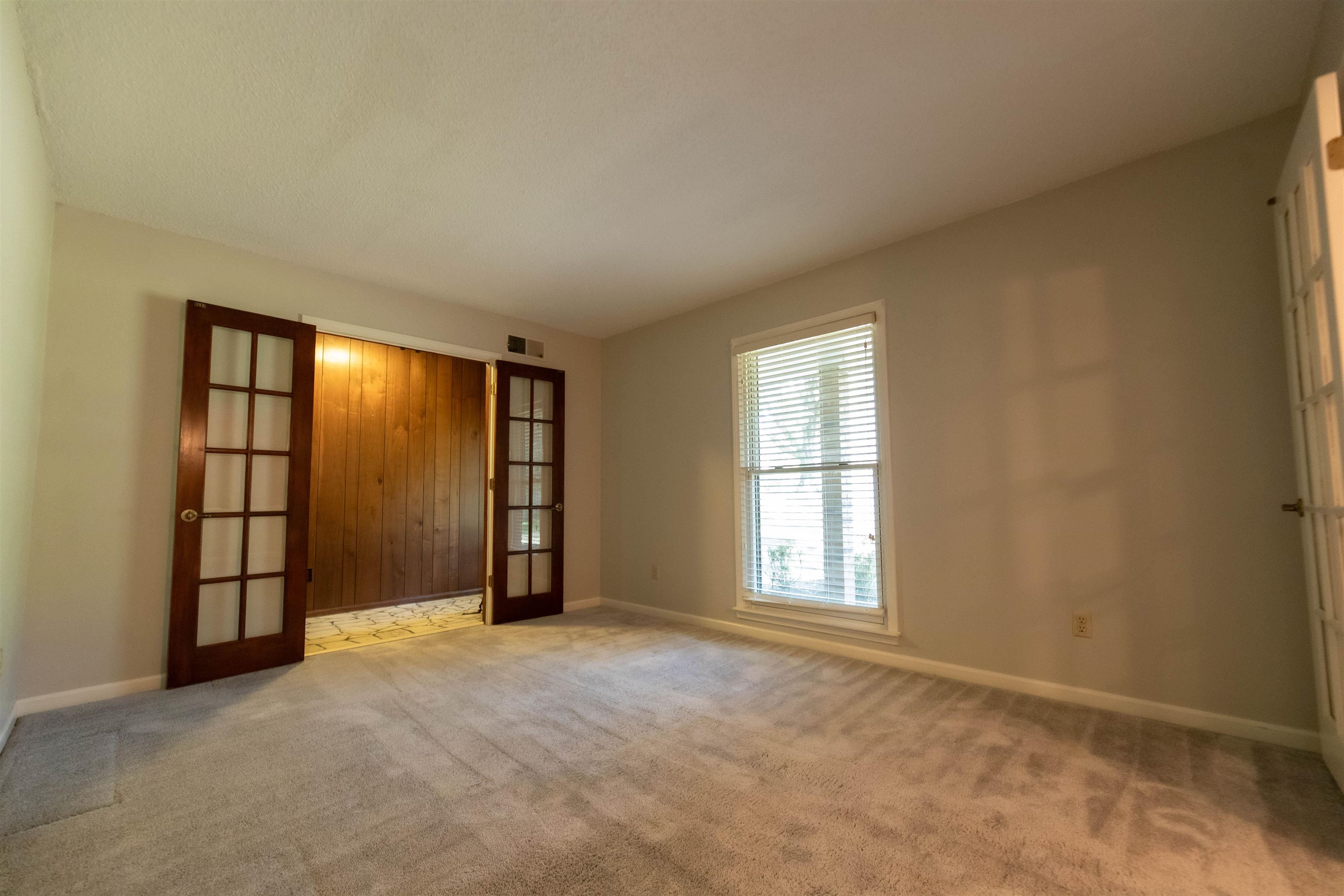 653 Oak Wild Cove Collierville, TN 38017 - Photo 8 of 20 Carpeted spare room with french doors