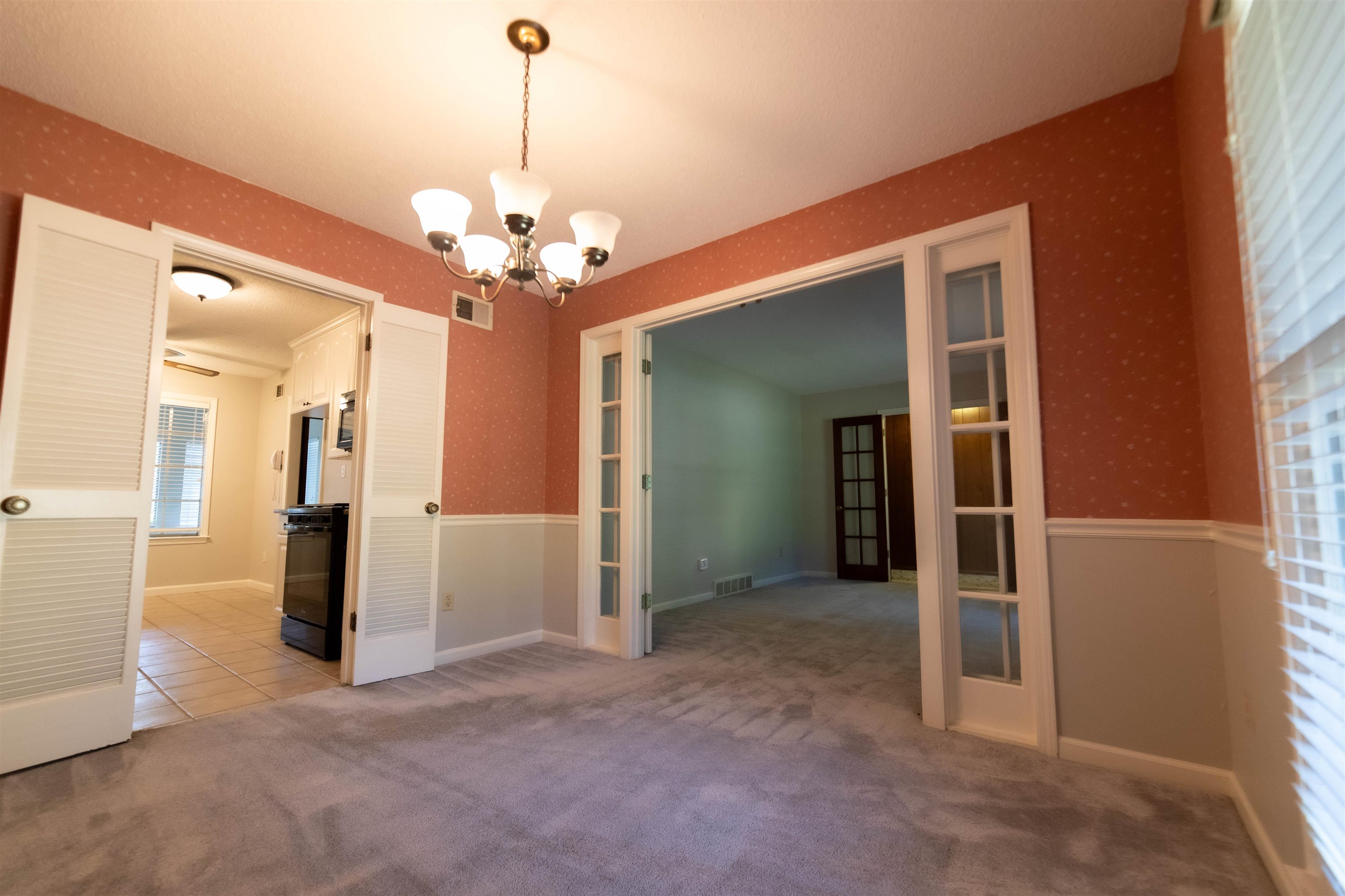 653 Oak Wild Cove Collierville, TN 38017 - Photo 10 of 20 Carpeted empty room with a chandelier
