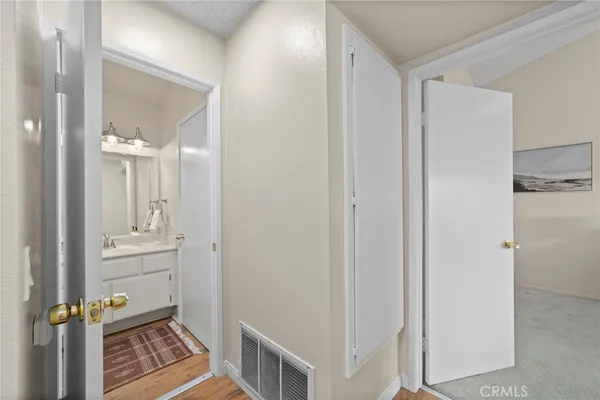 a view of a bathroom from a hallway