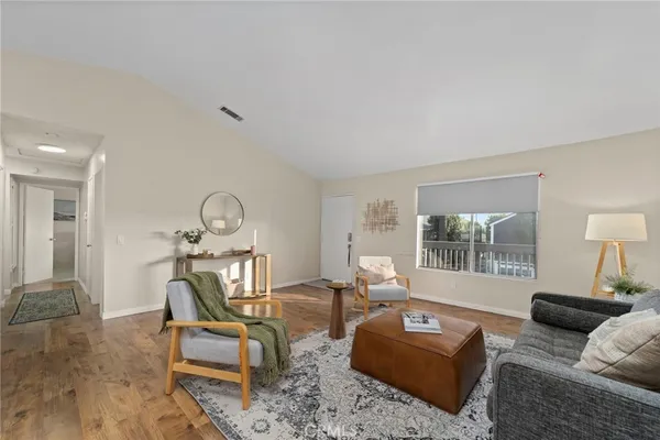 a living room with furniture and a large window