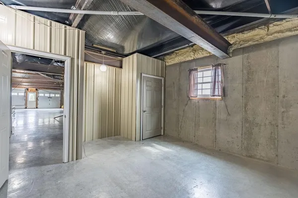a view of hallway with windows