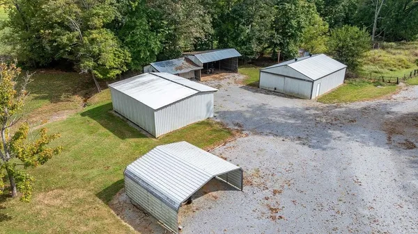 a view of a backyard with chairs and a small yard