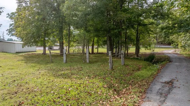 a backyard of a house with lots of green space