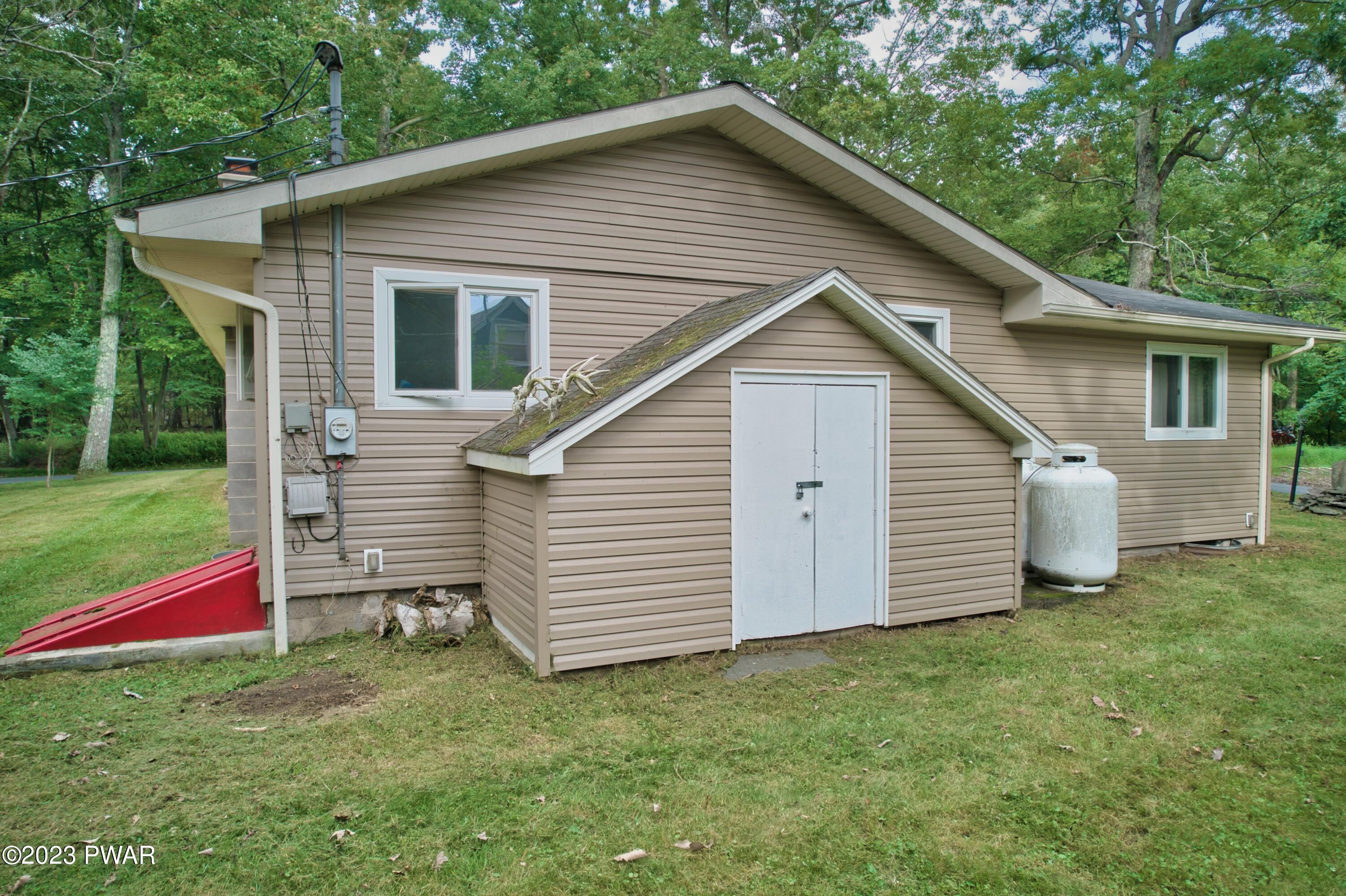 149 Walker Lake Road Shohola, PA 18458 - Photo 51 of 51 a view of a house with a yard