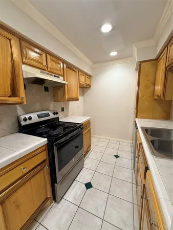 a kitchen with a stove and a microwave
