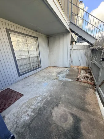 a view of an empty room with windows