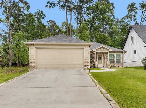 a front view of a house with yard