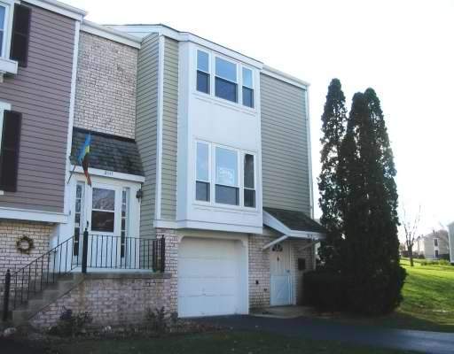 2113 Kettering Road, Unit 2113 Hoffman Estates, IL 60169 - Photo 1 of 1 a front view of a house with a yard