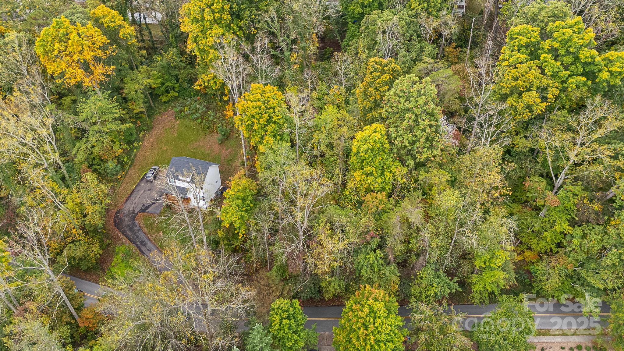 455 Governors View Road Asheville, NC 28805 - Photo 14 of 26 an aerial view of residential house with outdoor space and trees all around