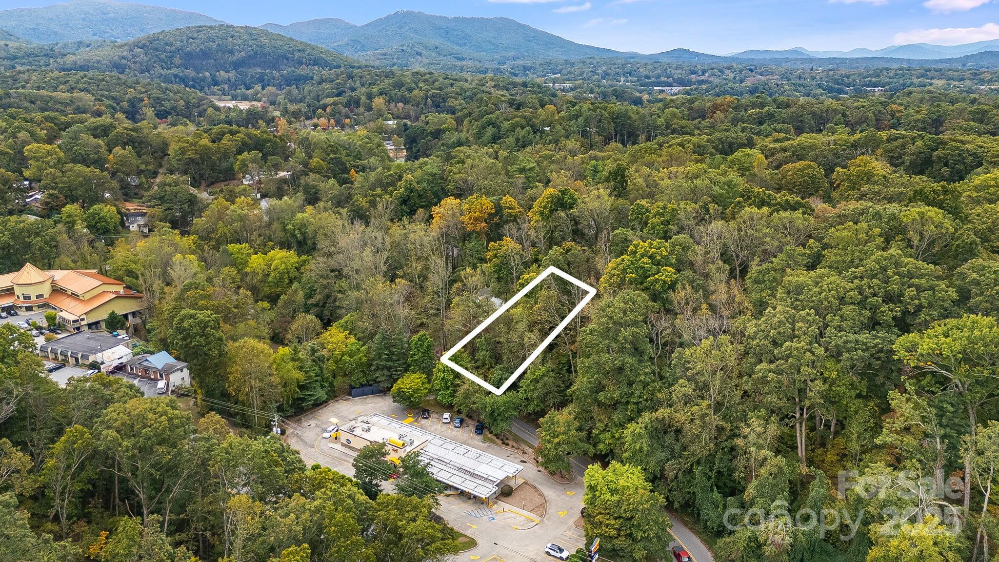 455 Governors View Road Asheville, NC 28805 - Photo 6 of 26 an aerial view of a house with a yard