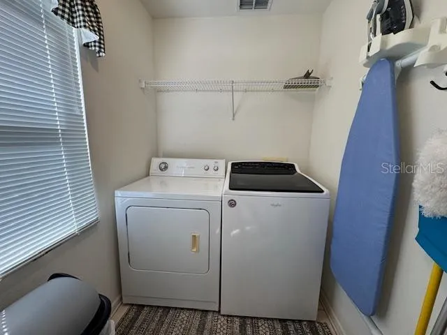 a utility room with dryer and washer