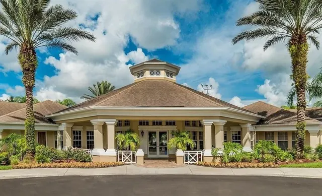 front view of a building with a garden