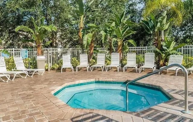 a view of a swimming pool with a patio