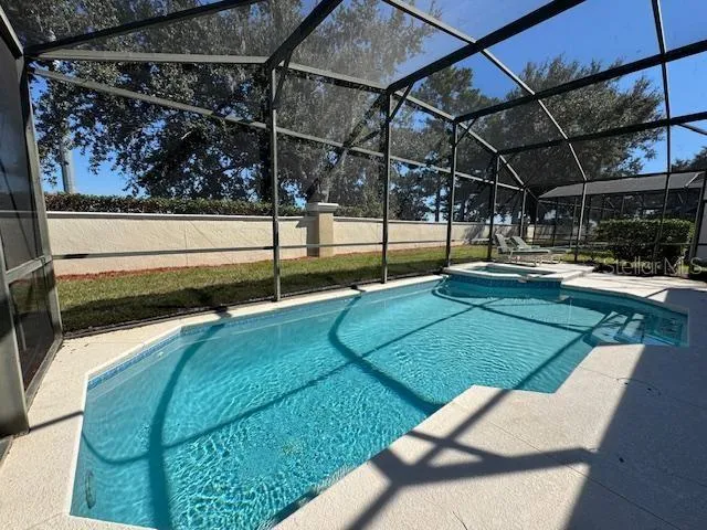 a view of a backyard with sitting area