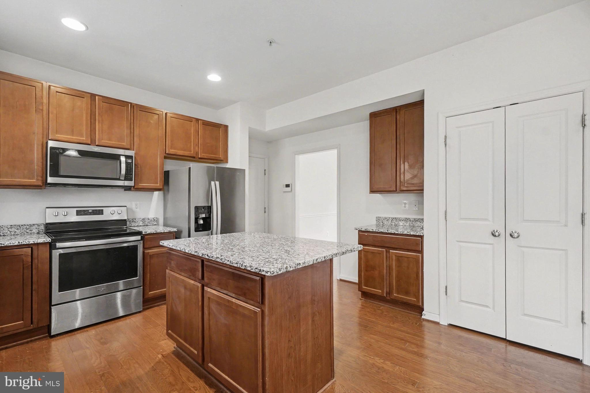 35 Sparrows Way Elkton, MD 21921 - Photo 12 of 36 a kitchen with stainless steel appliances granite countertop a stove top oven a sink and a refrigerator