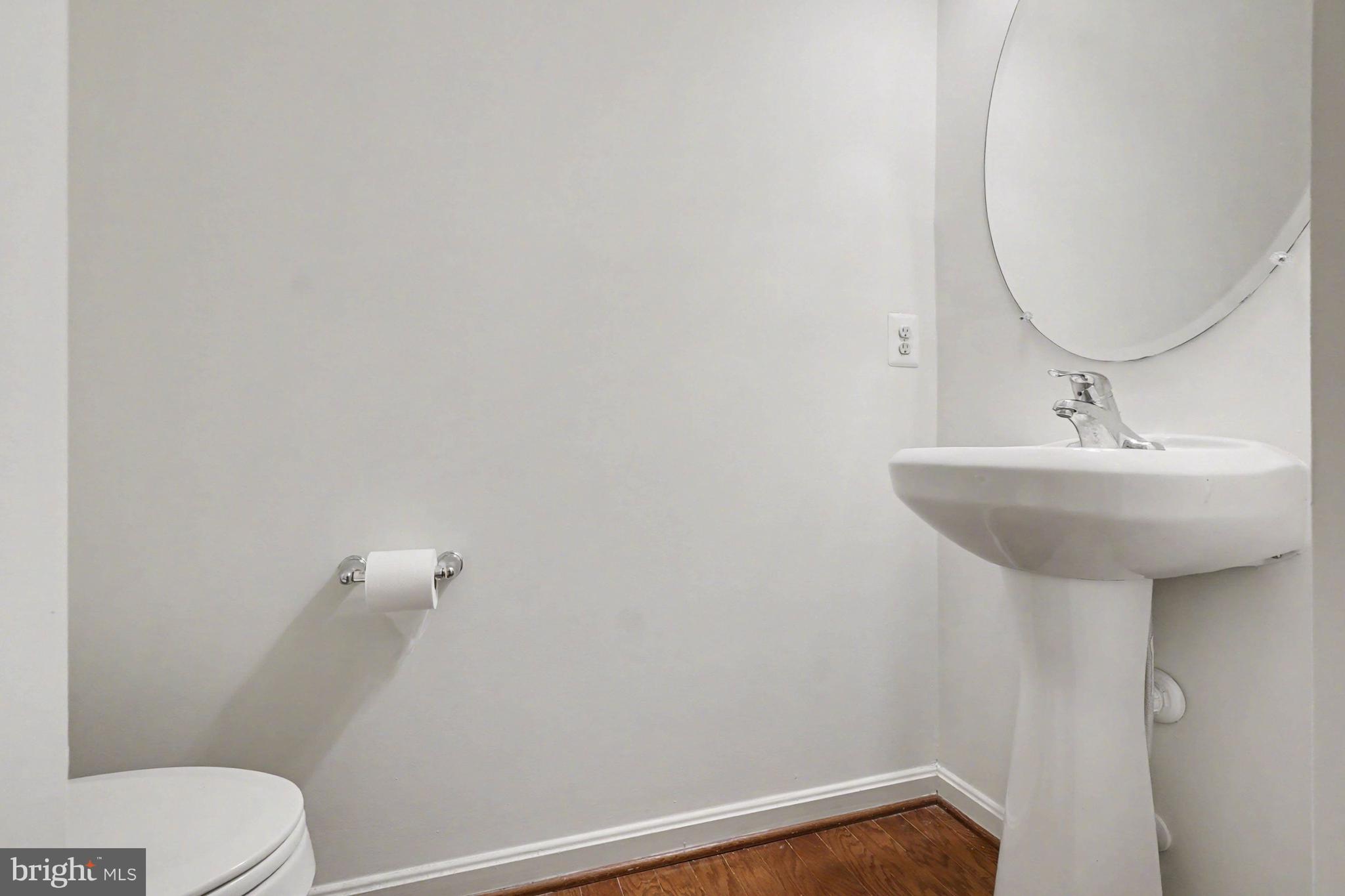 35 Sparrows Way Elkton, MD 21921 - Photo 15 of 36 a bathroom with a sink a toilet and a mirror