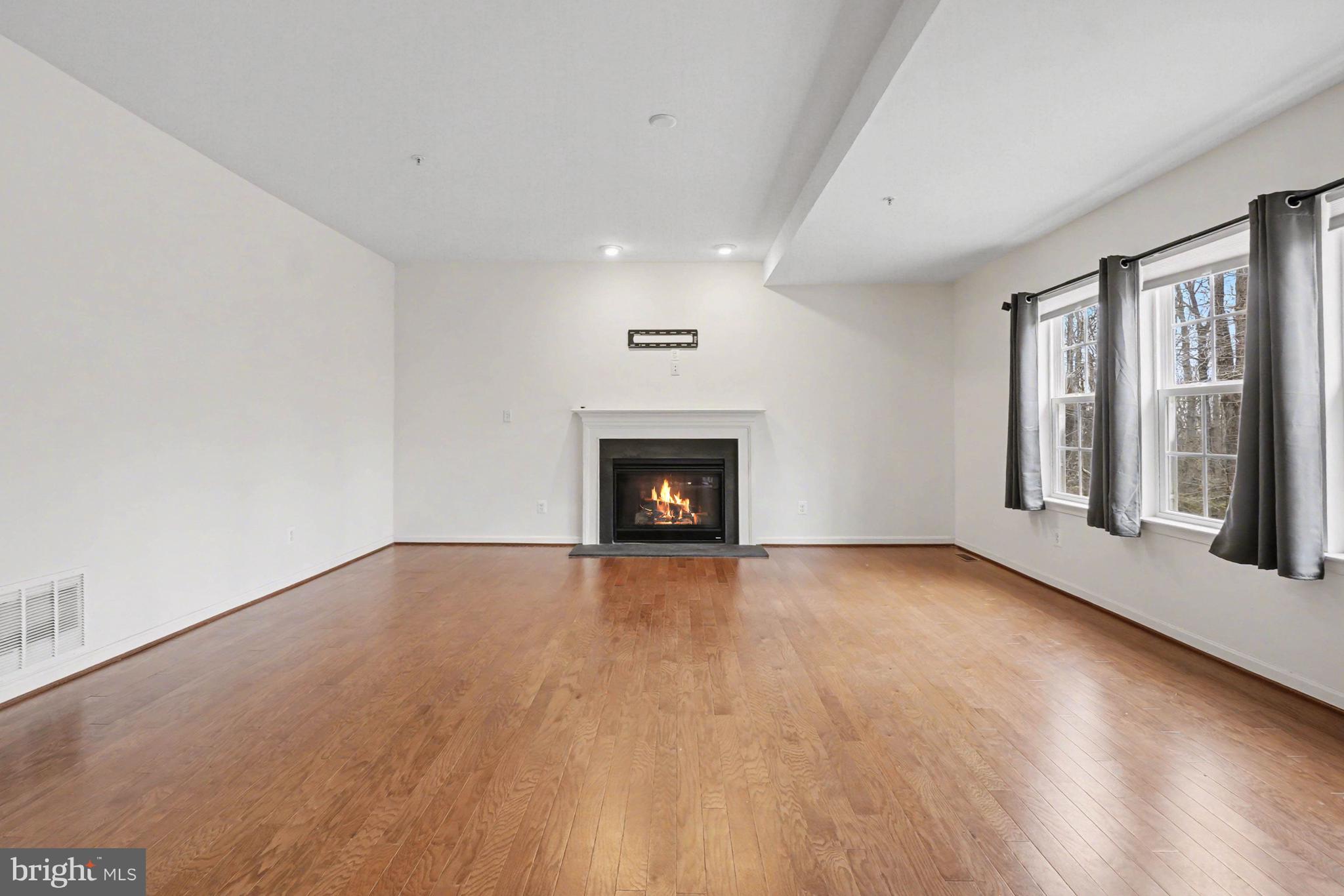 35 Sparrows Way Elkton, MD 21921 - Photo 4 of 36 wooden floor in an empty room with a fireplace