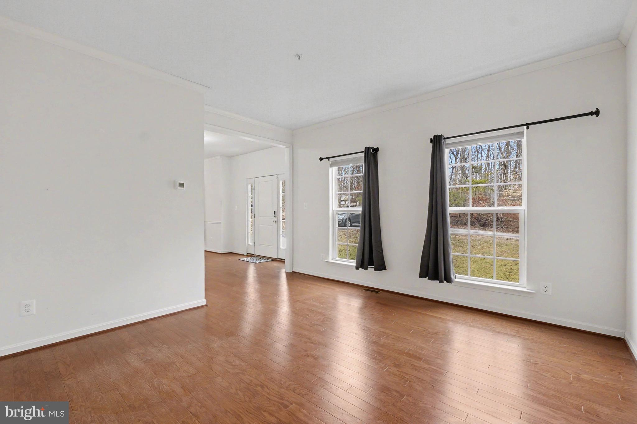 35 Sparrows Way Elkton, MD 21921 - Photo 6 of 36 an empty room with wooden floor and windows
