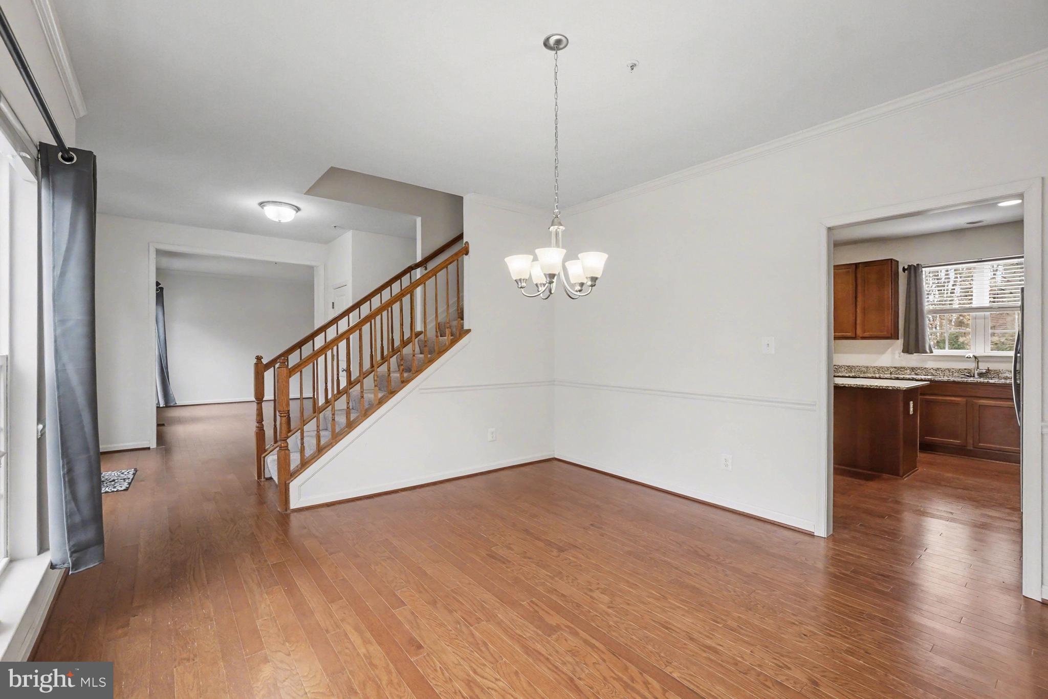 35 Sparrows Way Elkton, MD 21921 - Photo 8 of 36 a view of a room with wooden floor and kitchen view