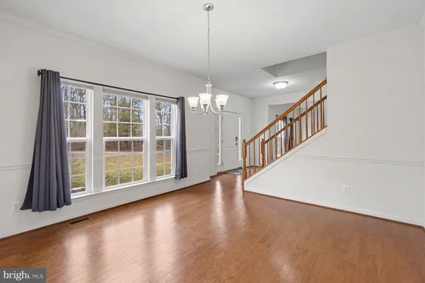 a view of staircase with wooden floor and staircase