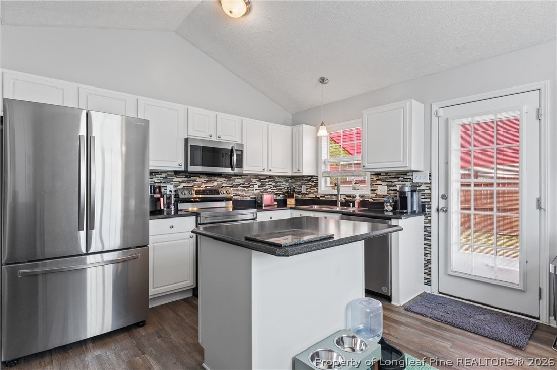 122 Raymond Street Raeford, NC 28376 - Photo 11 of 36 a kitchen with a refrigerator stove and sink