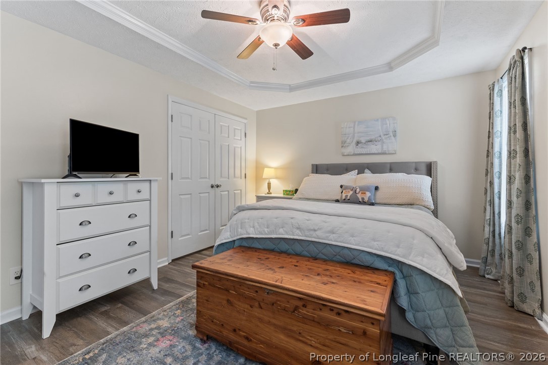 122 Raymond Street Raeford, NC 28376 - Photo 18 of 36 a bedroom with a bed and a flat screen tv