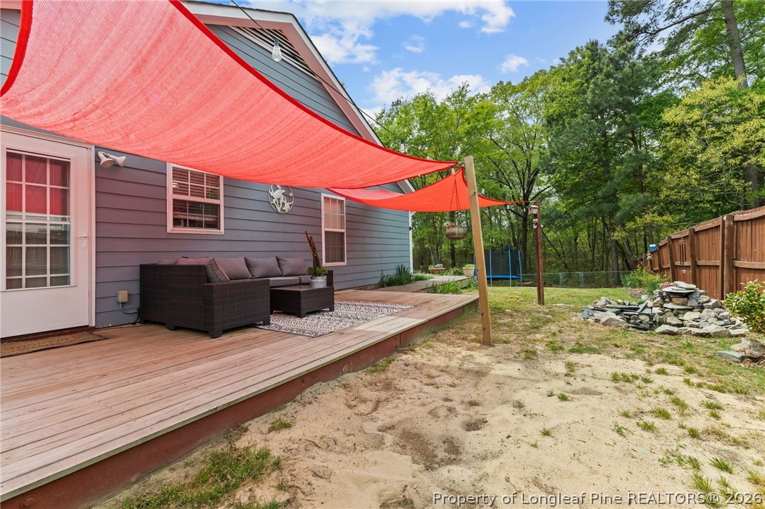 122 Raymond Street Raeford, NC 28376 - Photo 26 of 36 a view of a house with backyard and sitting area