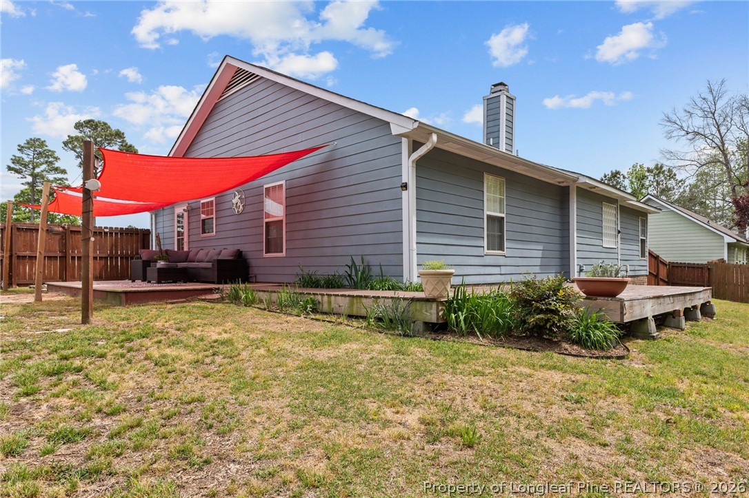 122 Raymond Street Raeford, NC 28376 - Photo 27 of 36 a view of a house with backyard and sitting area