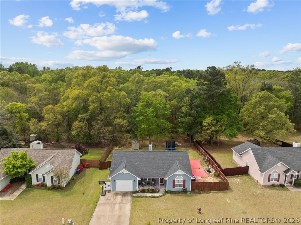 122 Raymond Street Raeford, NC 28376 - Photo 33 of 36 an aerial view of a house with swimming pool and large trees